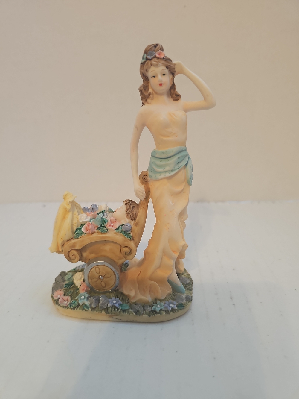 vintage piece featuring a woman and a child in a wagon 5.5"